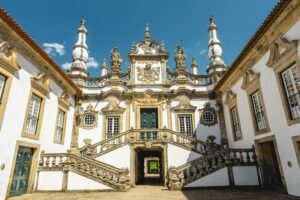 Explore the ornate Baroque facade of the historic Mateus Palace in Vila Real, Portugal.